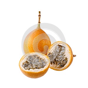 Whole and sliced exotic orange yellow granadilla fruit closeup isolated on white