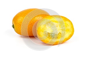 Whole and sliced kumquat fruits