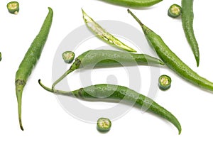 whole and slices lumbre green chili pepper isolated on white background photo