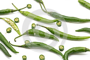 whole and slices lumbre green chili pepper isolated on white background photo