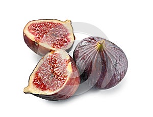 Whole and two halves of figs close-up isolated on white background