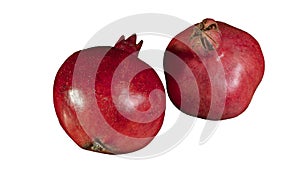 Whole two red pomegranates isolated on white background. Garnet is a symbol of Judaism, fertility and abundance