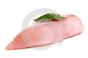 Whole uncooked boned chicken breast with bay leaf isolated on white photo