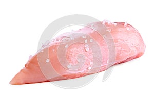 Whole uncooked boned chicken breast with rock salt isolated on white photo