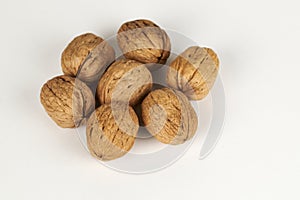Whole walnuts on a white background