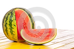 Whole watermelon with cut slice. Summer refreshment image with c