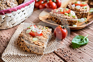 Whole wheat bread with fish spread, tomato and onion