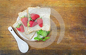 Whole wheat bread slice and strawberry