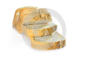 Whole wheat bread stack on white background.