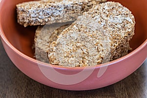 Whole wheat breakfast biscuits in brown bowl
