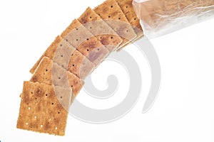 Whole Wheat Crackers Spilling From Package Isolated On White