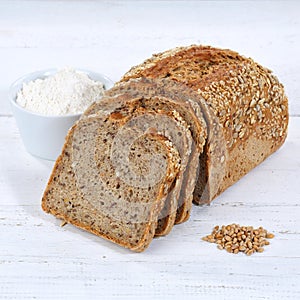 Whole wheat grain bread slice slices sliced loaf square on wooden board