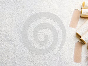 Whole wheat Italian pasta - raw tortiglioni- in the corner of a white coloured background with copy space for food advertisement