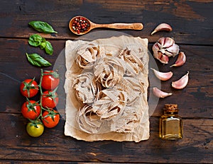 Whole wheat pasta tagliatelle, olive oil, vegetables and herbs