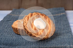 Whole wheat tarts with chocolate frangipane, figs, apple and pears on wooden background, top view