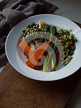 Wholefoods rustic vegetable dish on wooden table