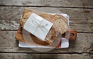 Wholegrain rye loaf bread with various seeds, sliced portions