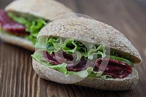 Wholegrain sandwiches with salame and lettuce