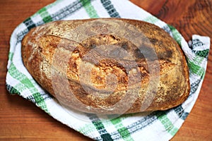 Wholegrain sourdough bread loaf, slashed, crusty , freshly baked