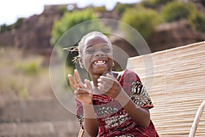 Wholeheartedly Laughing African Girl Enjoying A Joke photo