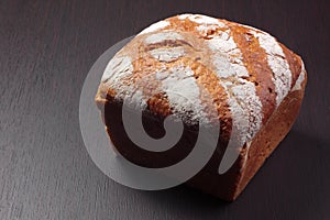 Wholemeal bread on dark board