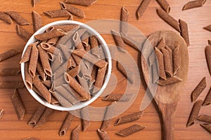 Wholemeal Pasta. Integral Penne into a bowl