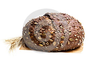 Wholemeal rye bread with sunflower and pumpkin seeds isolated on white
