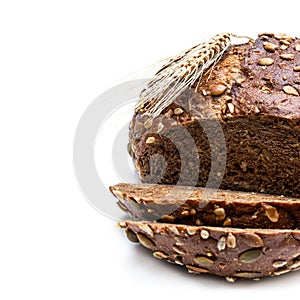 Wholemeal rye bread with sunflower and pumpkin seeds isolated on white