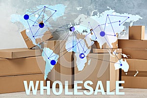 Wholesale business. World map and parcel boxes on background