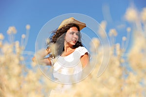 Wholesome brunette woman outdoors in a field