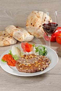 Wholesome platter of mixed meats, Balkan food photo