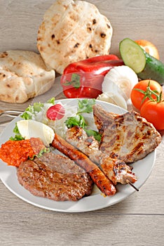Wholesome platter of mixed meats, Balkan food photo