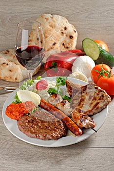 Wholesome platter of mixed meats, Balkan food photo