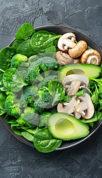 Wholesome vegan lunch bowl with avocado, mushrooms, broccoli, and spinach for a nutritious meal