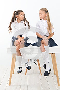 Why are you sad. Schoolgirls tidy hairstyle relaxing having rest. School uniform. School club. Little schoolgirls