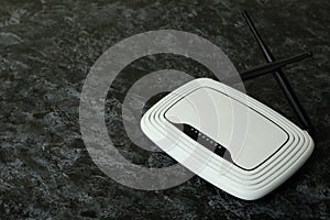 Wi-Fi router with external antennas on black smokey background