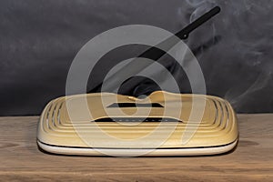 Wi-Fi router fires on a table in the house, smoke and fire.