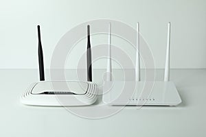 Wi-Fi routers with external antennas on white background photo