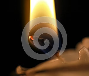 The wick of a burning candle