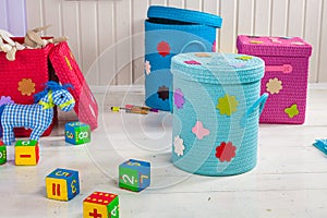 Wicker basket of colored storage and toys