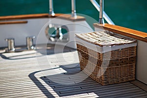 Wicker basket on deck on a yacht
