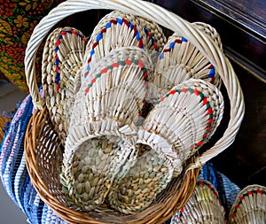 Wicker basket filled with Russian bast shoes