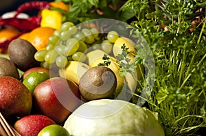 Wicker basket with fruit and vegetables photo