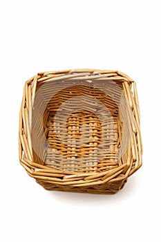 Wicker basket isolated on a white background