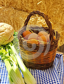 Wicker basket made with homemade eggs on the table photo