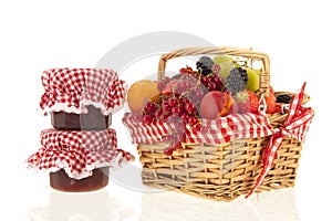 Wicker basket with mixed summer fruit