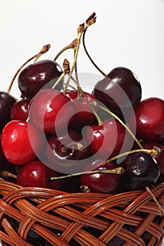 Wicker basket with ripe cherries