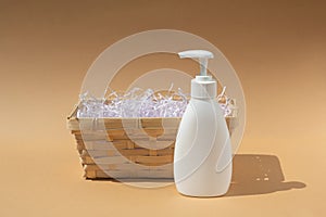 Wicker basket and white dispenser bottle, for spa cosmetics