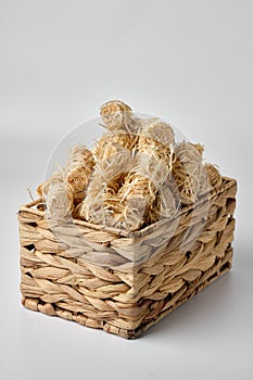 Wicker box of kindling roll isolated on white