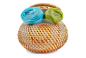 Wicker box of yellow color with dark blue and green thread